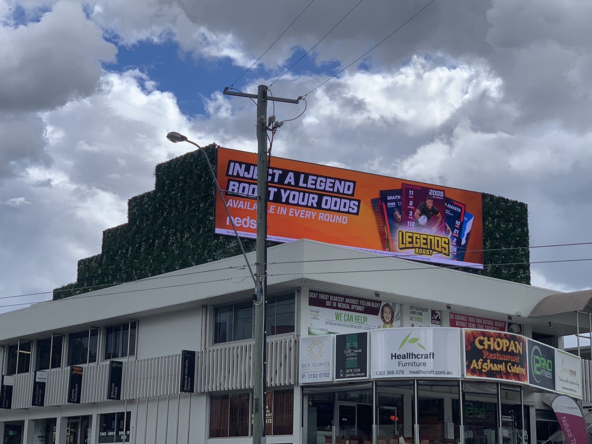 Outdoor Elements Signage Using Evergreen Premium Green Wall Panels - Evergreen Walls