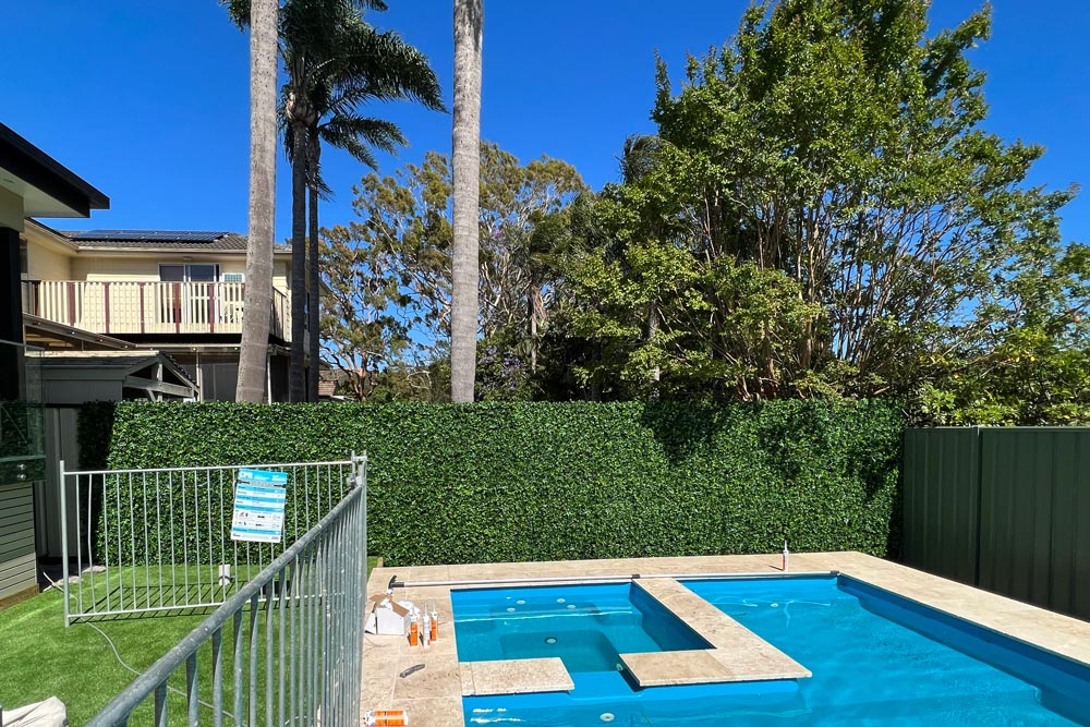 Transforming Outdoor Spaces: Impressive Artificial Green Walls on Colorbond Fences with Evergreen Walls - Evergreen Walls