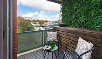 Balcony with artificial coastal green wall